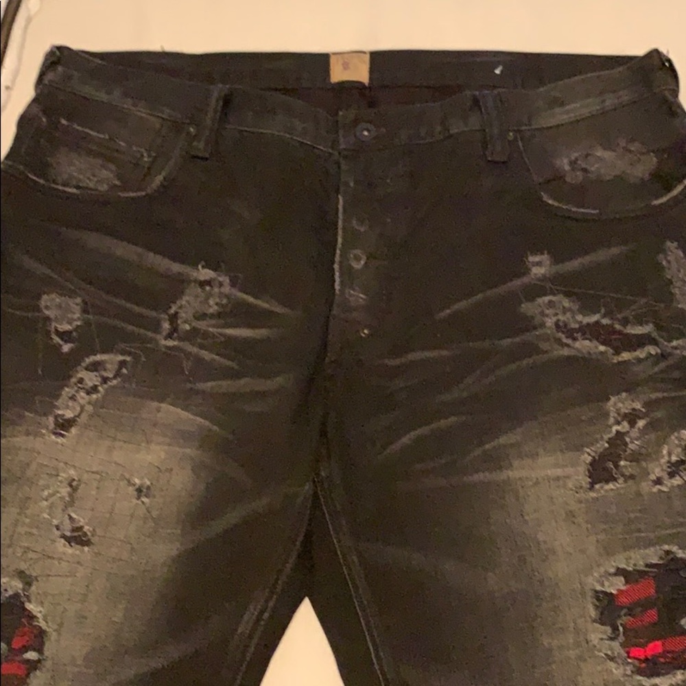 Black with a little red prp jeans